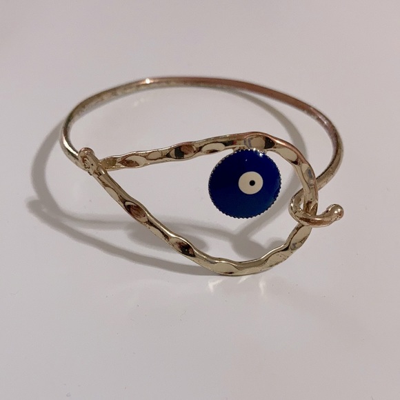 Gold tone bangle bracelet with eye - Picture 1 of 3
